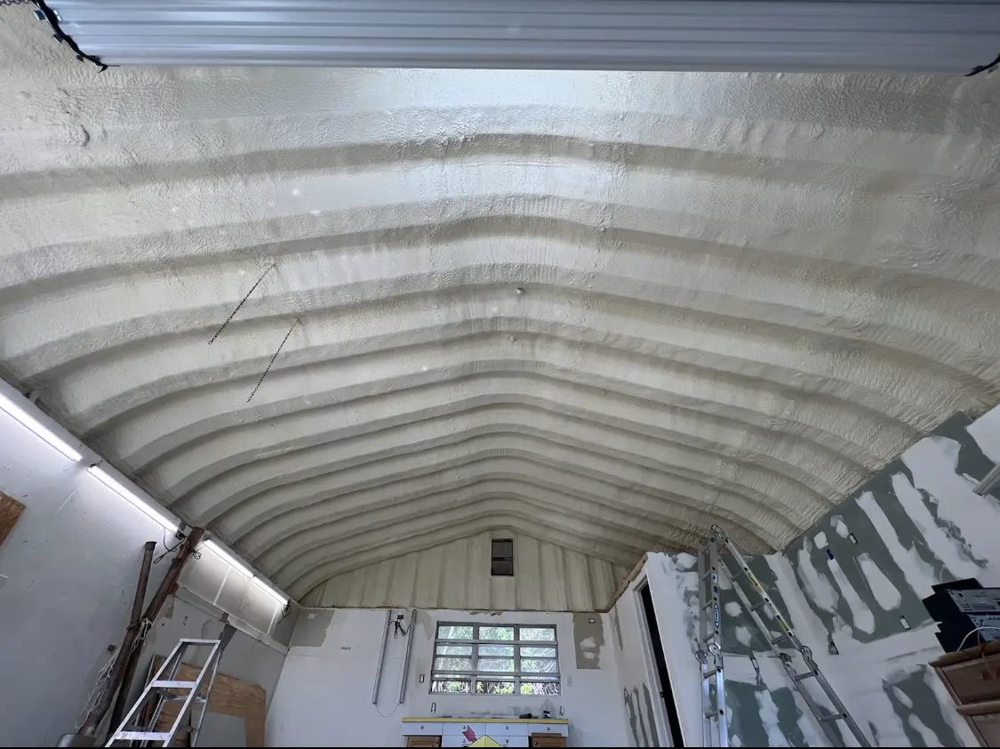 Spray polyurethane foam applied to the underside of a metal roof deck in Dry Run